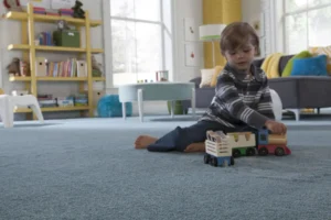 Children crawling on carpet cleaned by Vital Clean Carpet Cleaning. Residue free carpet cleaning