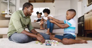 Children and pets safely playing on professionally cleaned carpet. Happy family on clean carpets after Vital clean carpet cleaning clean their carpets